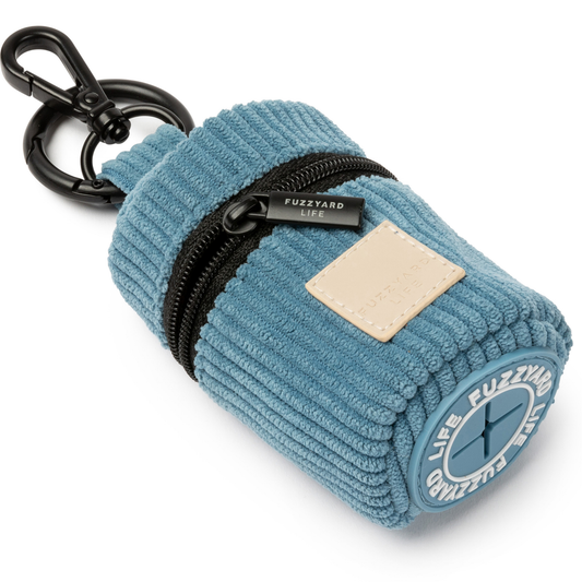 French blue corduroy poop bag dispenser keychain pouch with a black zipper on a white background